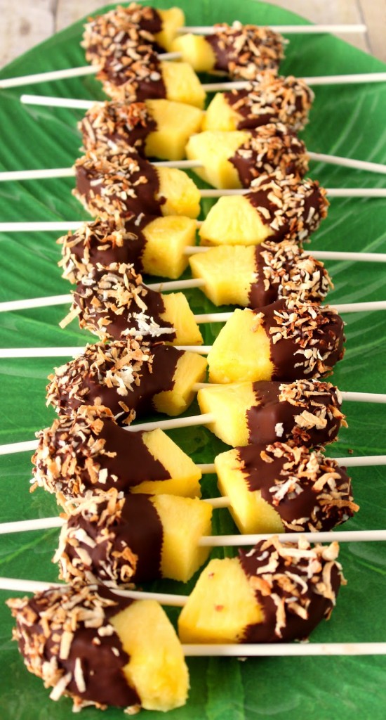 These Frozen Chocolate Dipped Pineapple Pops are the perfect way to cool down on a hot summer day! Make some today and stick them in the freezer to have on hand all summer long! - kudoskitchenbyrenee.com Frozen Chocolate Dipped Pineapple Pops with Toasted Coconut - kudoskitchenbyrenee.com