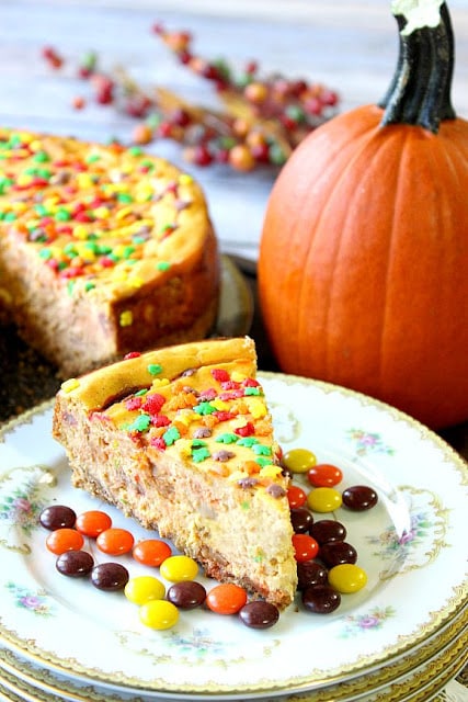 Pumpkin and peanut butter candies are a match made in heaven, especially when added to the creamy sweetness of cheesecake. The pretzel graham cracker crust simply adds to this cheesecake's over-the-top deliciousness. - Kudos Kitchen by Renee Reese's Pieces Pumpkin Cheesecake