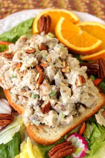 Orange Cashew Chicken Salad uses poached chicken thighs, roasted cashews and pecans, along with a touch of orange zest and juice. It's simply the best chicken salad, ever! - Kudos Kitchen by Renee Orange Cashew Chicken Salad - www.kudoskitchenbyrenee.com