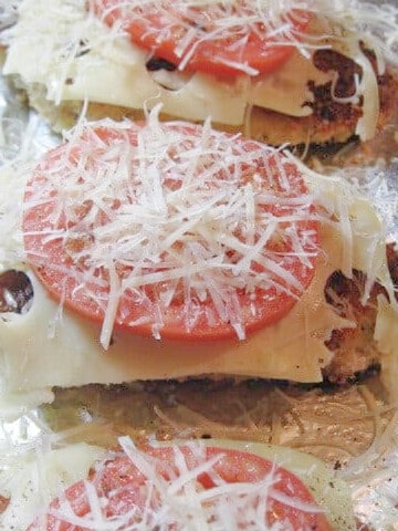 Some Chicken Zucchini Parmesan on a baking sheet with aluminum foil.