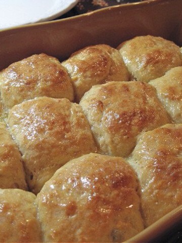 A ceramic baking dish filled with homemade Hawaiian Sweet Rolls.