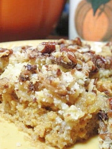 A closeup photo of a Toffee Topped Pumpkin Crisp on a yellow plate.