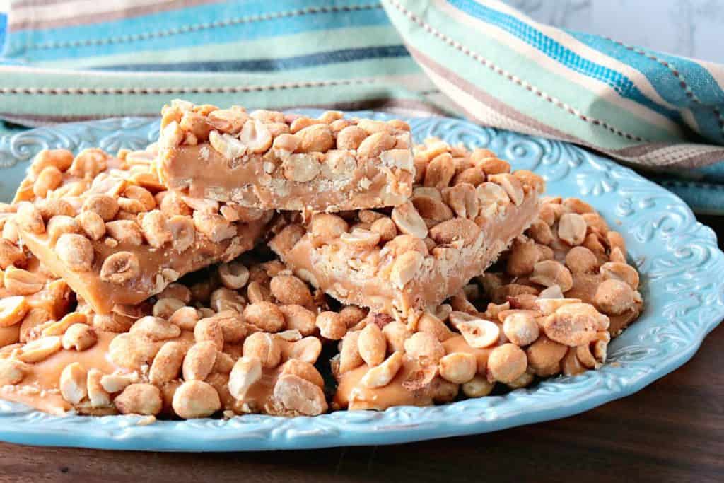 Homemade Copycat Payday Candy Bars Homemade Copycat Payday Candy Bars on a blue plate.