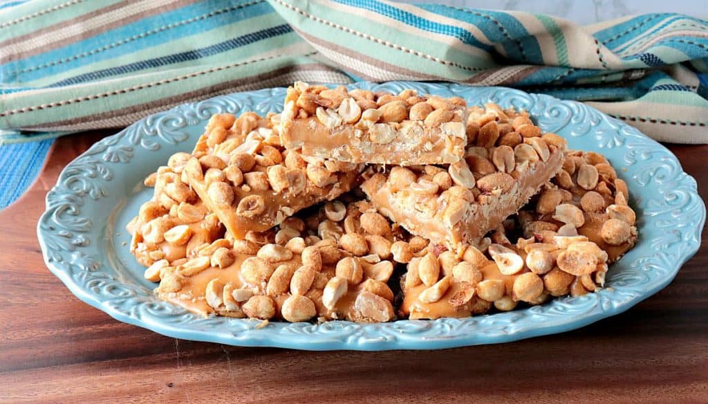 Homemade Payday Candy bars on a blue oval plate.