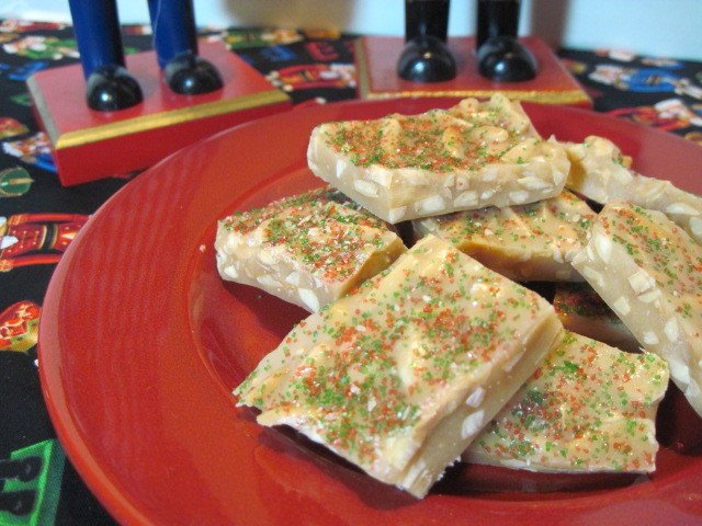 Almond Butter Crunch Candy on a red plate.