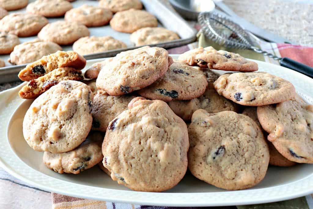 Vintage Rocks Cookies on a platter with a cookie sheet and cookies in the background