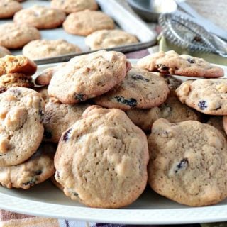 Vintage Rocks Cookies on a platter with a cookie sheet and cookies in the background