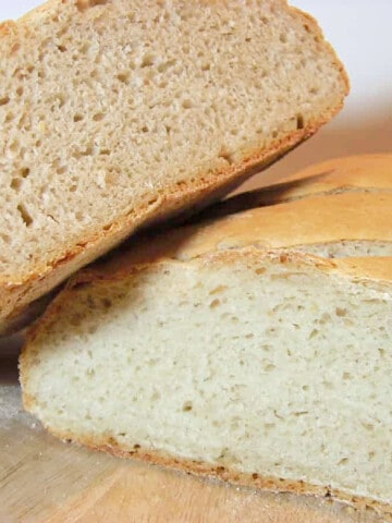 A cut in half loaf of Homemade Sourdough Bread.