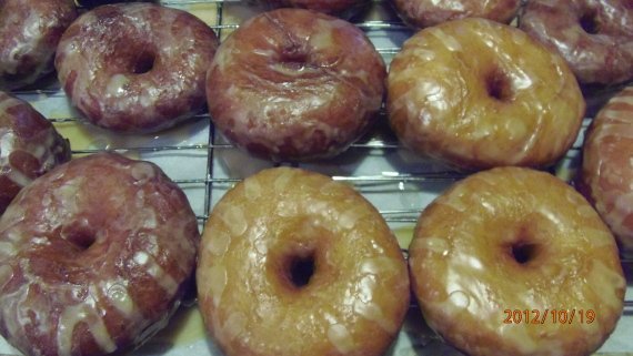 Homemade Glazed Apple Cider Donuts on a wire rack 