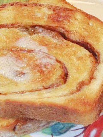 A closeup photo of the swirl of Buttermilk Raisin Bread with melted butter.