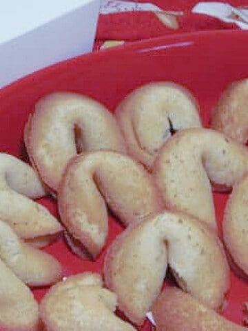 Homemade Fortune Cookies in a red dish.