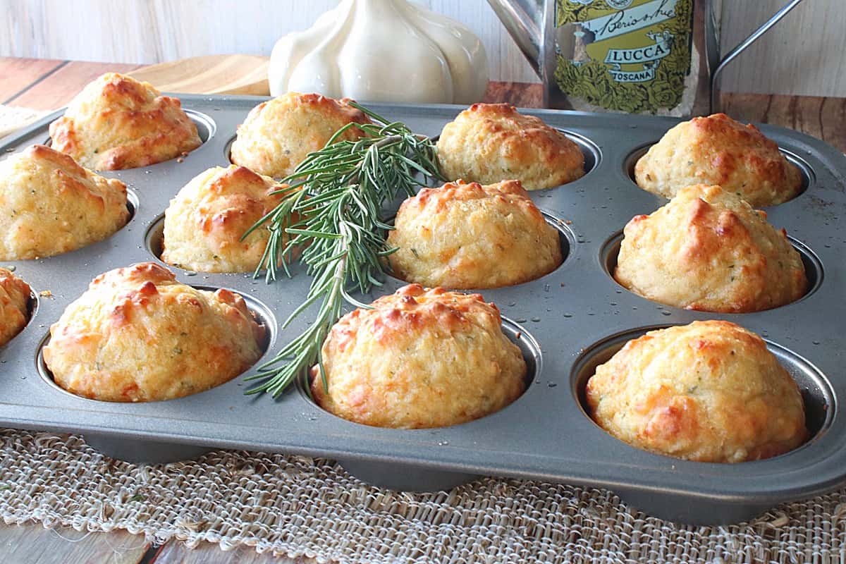 A muffin tin filled with Garlic Rosemary Focaccia Muffins.
