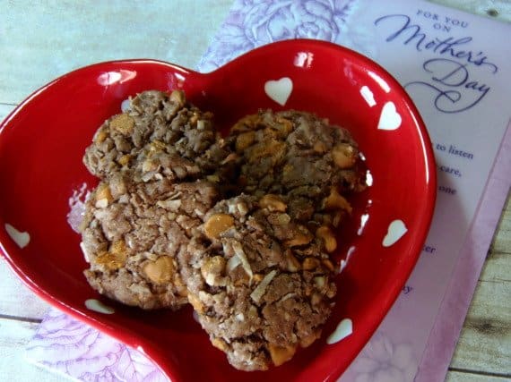 A red and white heart dish filled with four German Chocolate Cookies.