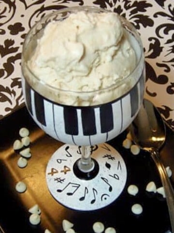 A cute black and white piano wine glass filled with Vanilla Malted Ice Cream.