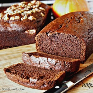 Two loaves of Chocolate Clove Pumpkin Bread with and without nuts.