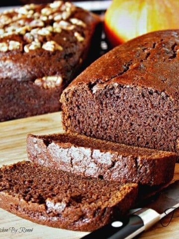 Two loaves of Chocolate Clove Pumpkin Bread with and without nuts.
