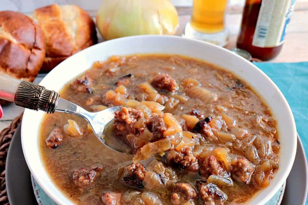 German Onion Soup with plenty of caramelized onions, beer, bratwurst and pretzel roll croutons will soon become a family favorite! Spoonful of German Onion Soup with Beer and Bratwurst