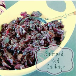 A white oval bowl filled with Sautéed Red Cabbage with Bacon.