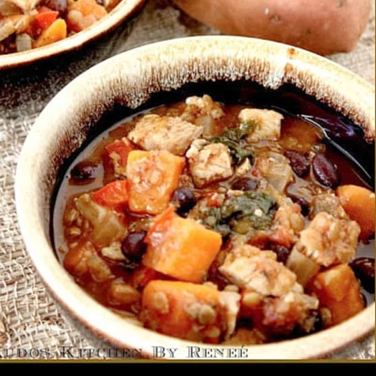Roasted Sweet Potato and Wild Rice Chowder A serving of Chicken and Sweet Potato Stew in a brown bowl with beans.
