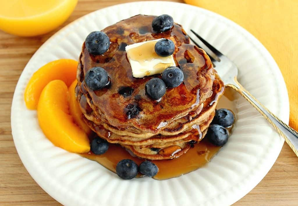 A stack of good for you Blueberry Peach Pancakes.