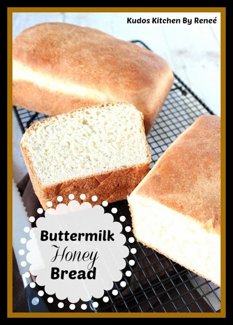 Vertical picture of two loaves of golden bread, one sliced in half, and other other a full loaf.