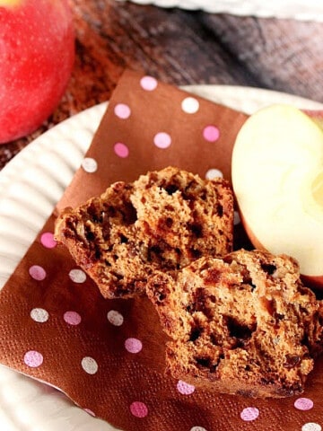 An Applesauce Cinnamon Muffin on a brown napkin with polka dots.