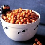 A cute black bear bowl filled with Sriracha Roasted Chickpeas.
