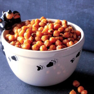 A cute black bear bowl filled with Sriracha Roasted Chickpeas.