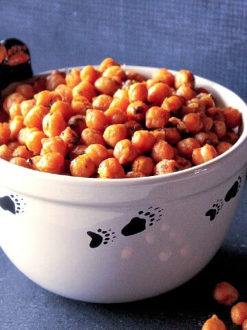 A cute black bear bowl filled with Sriracha Roasted Chickpeas.