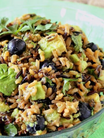 A glass bowl filled with Avocado and Wild Rice side dish.