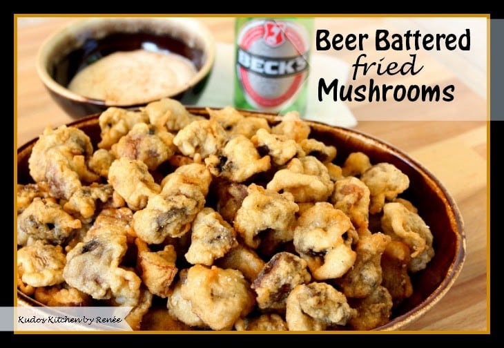 Beer Battered Fried Mushrooms Fried mushrooms in a brown oval with with a bottle of beer in the background.