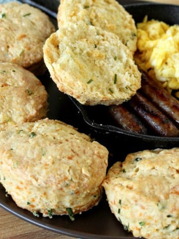 A cast iron skilled filled with Cheddar Chive Biscuits and sausage