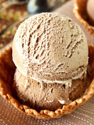 Two scoops of Root Beer Ice Cream and in waffle cone bowl.