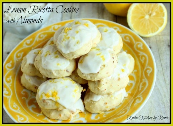 Lemon Ricotta Cookies with white icing and lemon zest on top.