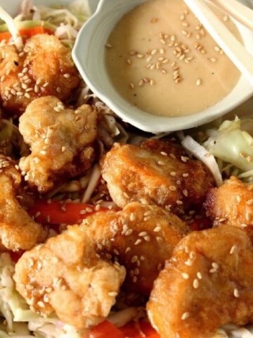 Sesame Seed Chicken Salad with an Asian dipping sauce on the side.