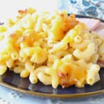 A closeup photo of Alfredo Macaroni and Cheese with melted cheese and elbow macaroni.