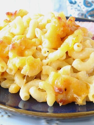 A closeup photo of Alfredo Macaroni and Cheese with melted cheese and elbow macaroni.