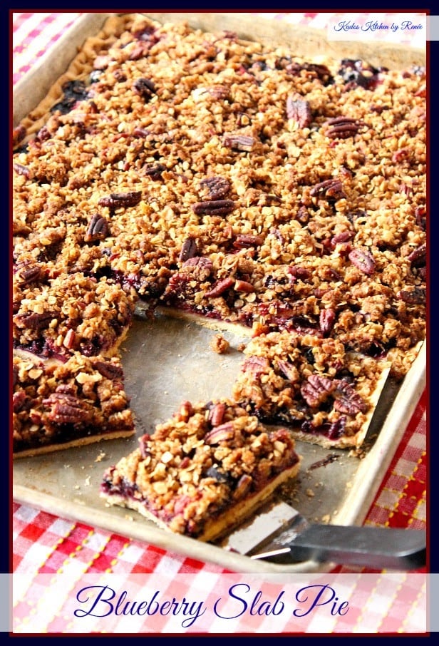 Blueberry Slab Pie has a crumble topping, is packed with fresh blueberries and has a light and flaky pie crust bottom.