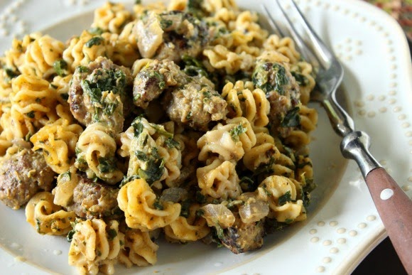 A serving of Pumpkin and Sausage Pasta with spinach and nutmeg.