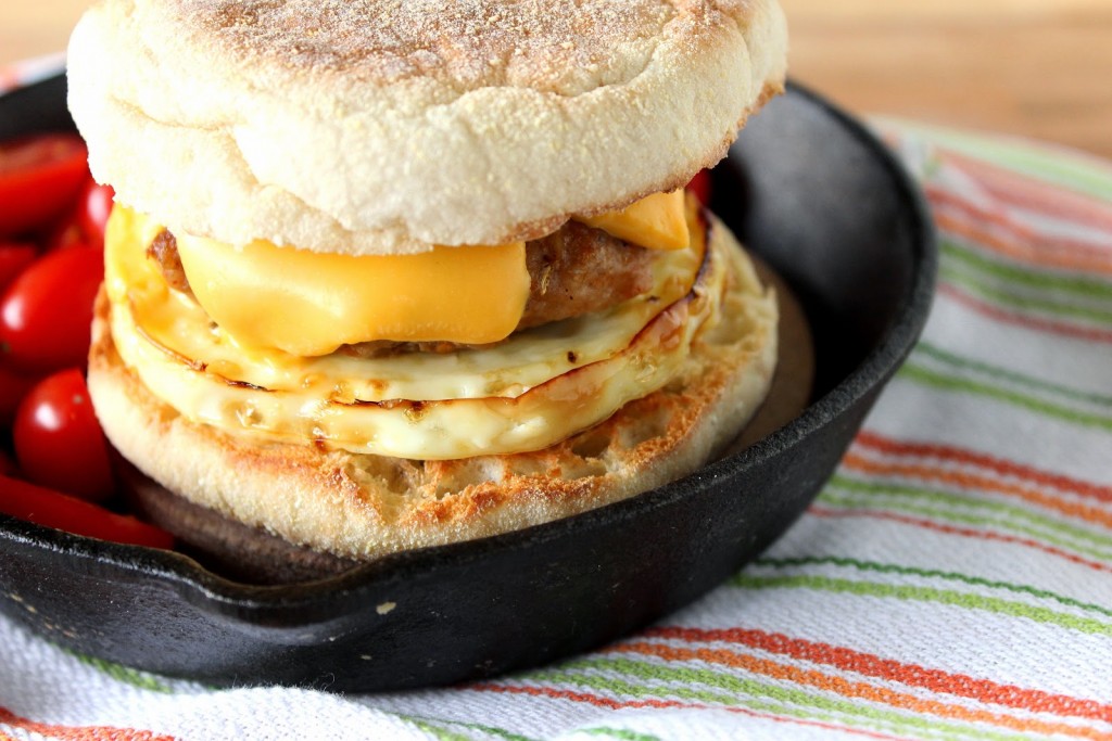 An offset photo of Turkey Breakfast Sausage on a homemade egg muffin sandwich.