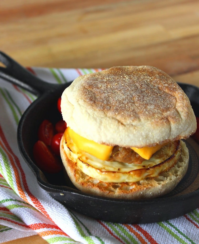 A vertical homemade egg muffin sandwich with Turkey Breakfast Sausage and cheese.