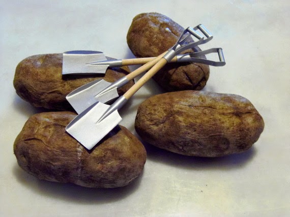 Baked potatoes with shovel forks.