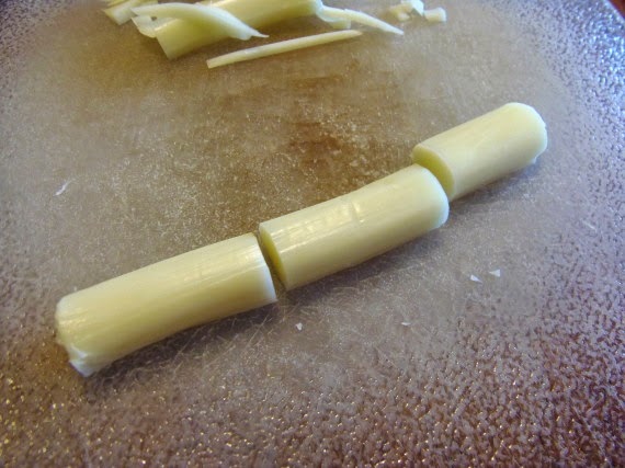 String cheese cut into three pieces.