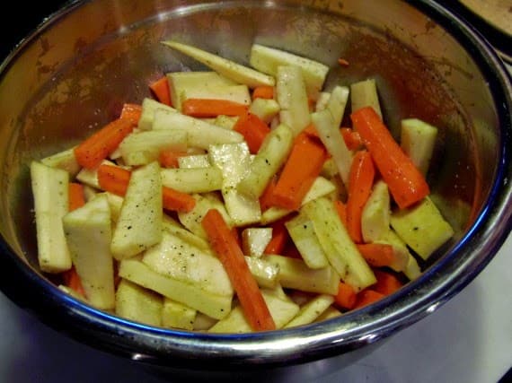 How to make roasted parsnips & carrots with cardamom and maple syrup.