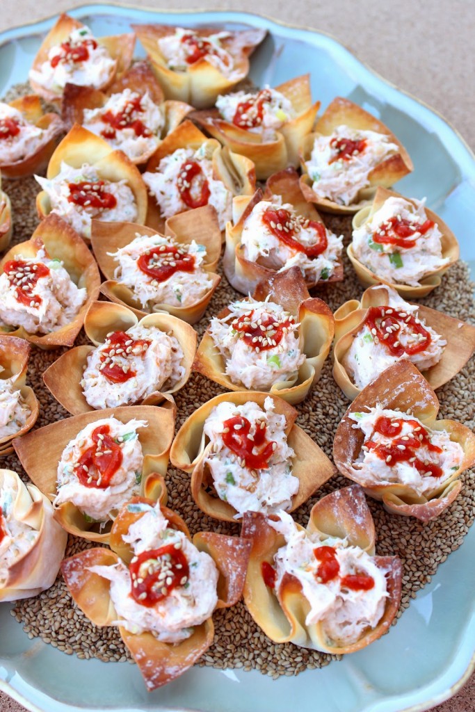 Spicy Baked Crab Rangoon with sesame seeds and Sriracha