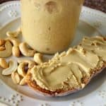 a slice of bread with homemade honey cashew butter spread on it