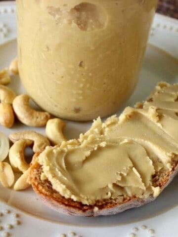 a slice of bread with homemade honey cashew butter spread on it