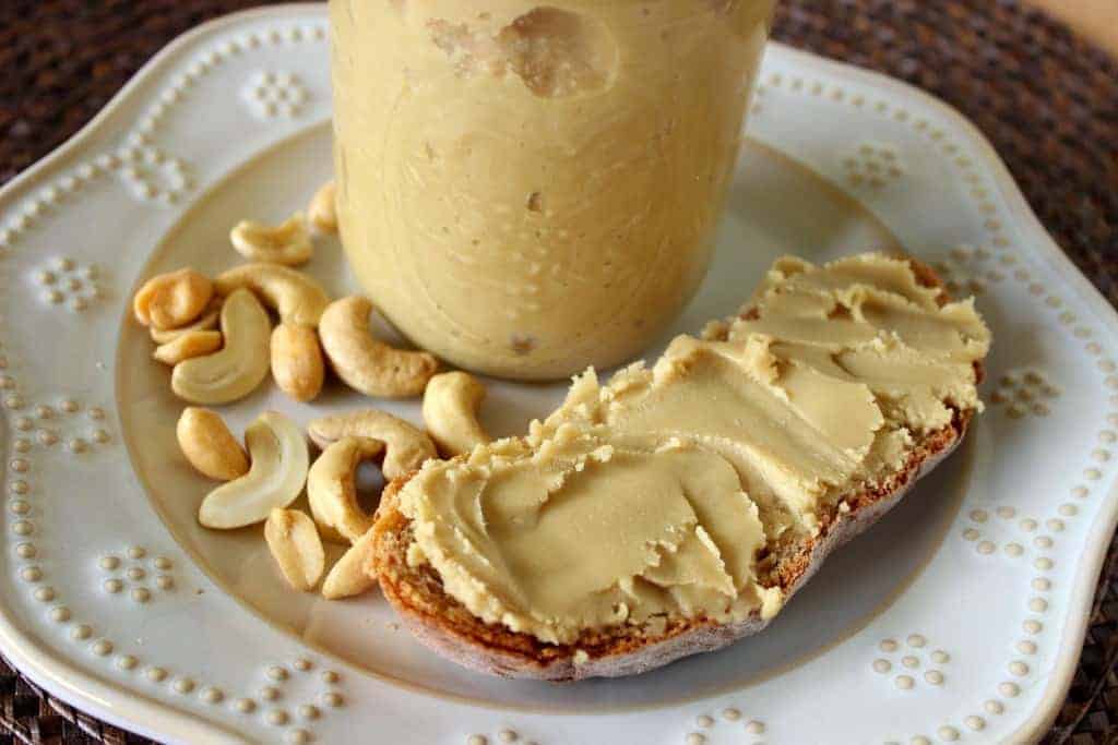 a slice of bread with homemade honey cashew butter spread on it
