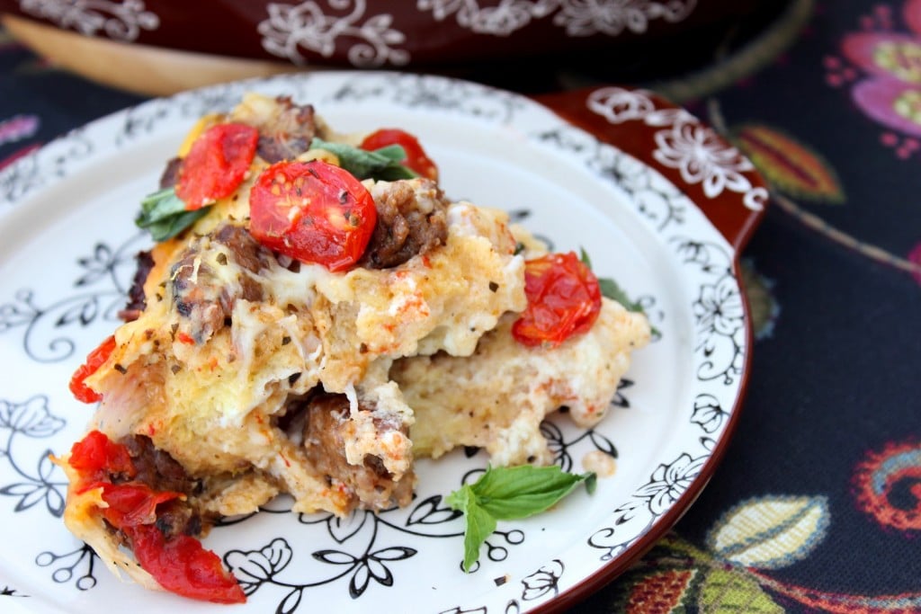 Lasagna Strata. Layers of bread, tomatoes, cheeses, Italian Sausage and eggs combine in this tasty and unique dish inspired by traditional pasta lasagna.
