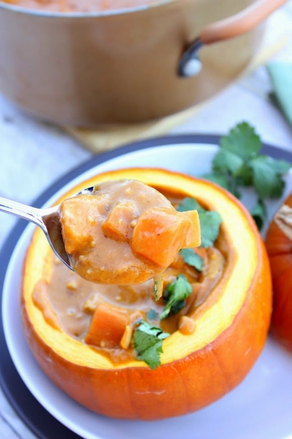 Serve this Peanut Butter, Chicken and Pumpkin Stew Recipe in a roasted pumpkin for drama and presentation / www.kudoskitchenbyrenee.com